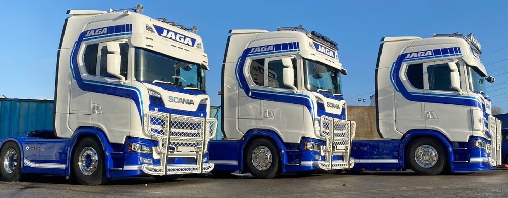 Fleet of company vehicles with matching vinyl wraps