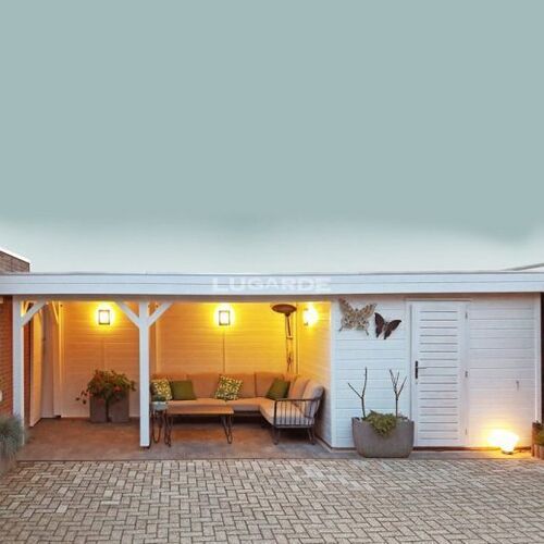 Stylish and versatile timber garden building featuring a combination of an open lounge area and a secure enclosed storage space. Painted in a crisp white finish, the structure includes clean lines and a minimalist design, enhanced by warm, ambient lighting fixtures. The lounge area is furnished with cozy seating, decorative pillows, and potted plants, creating a welcoming outdoor living space. Adjacent to this is a lockable door leading to the enclosed section, ideal for storage or workspace. Designed and installed by Forever Timber, this functional building is perfect for relaxing, entertaining, and organizing outdoor essentials.