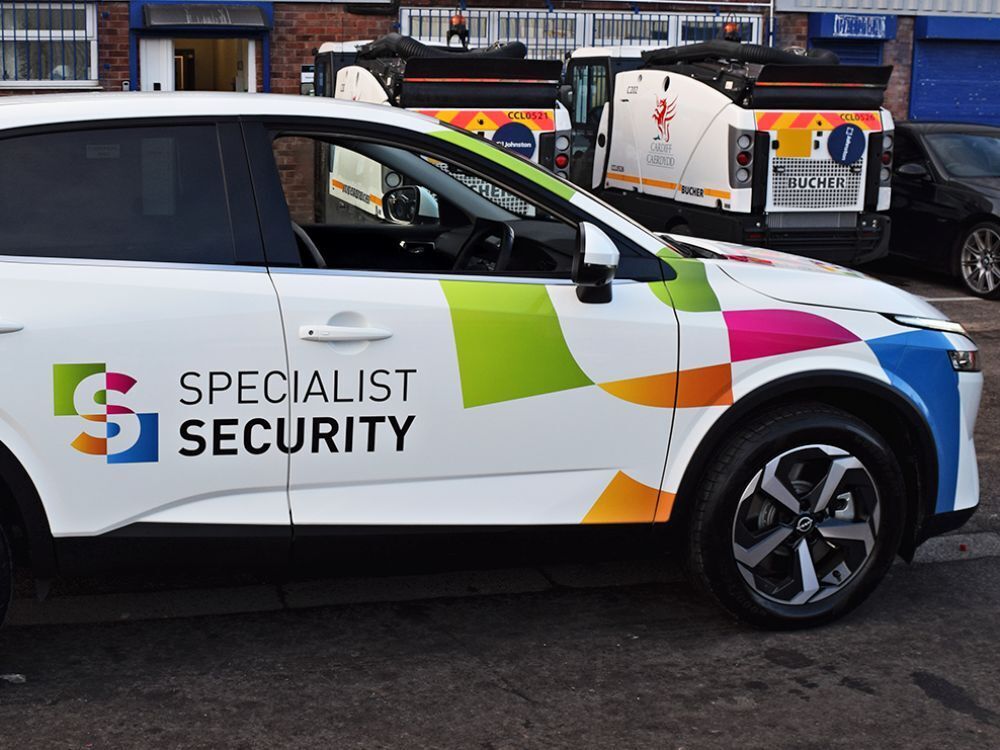 Specialist Security branded company graphics on front of Nissan Juke e-POWER.