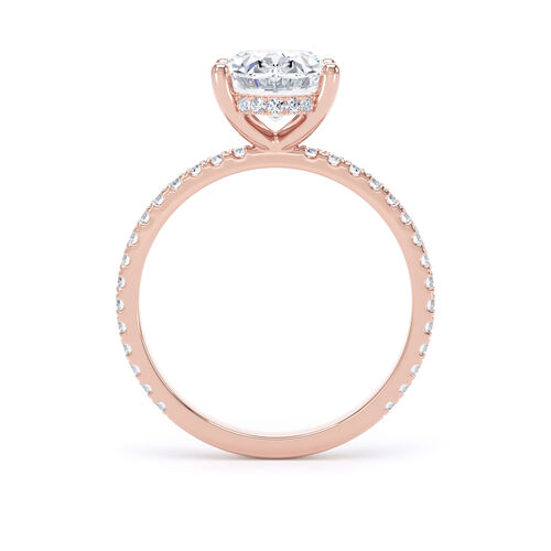 Oval solitaire with diamond set shoulders and hidden diamond detail