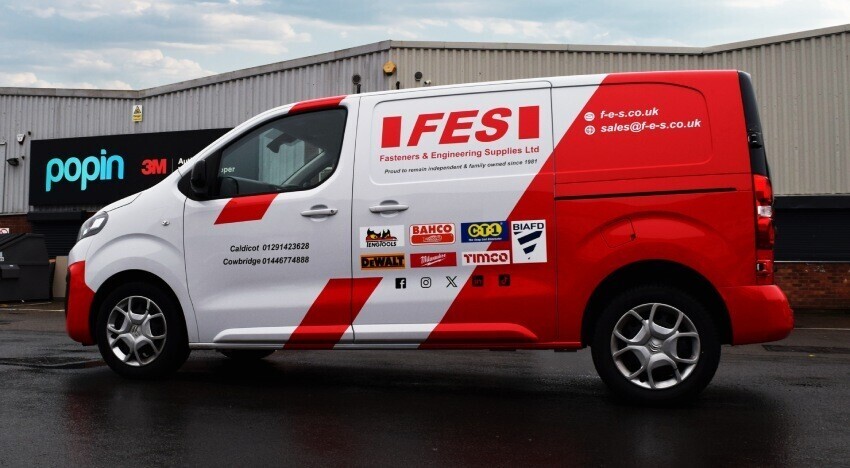 A Citroen Dispatch company van with red and white livery and graphics outside Popin in Cardiff.