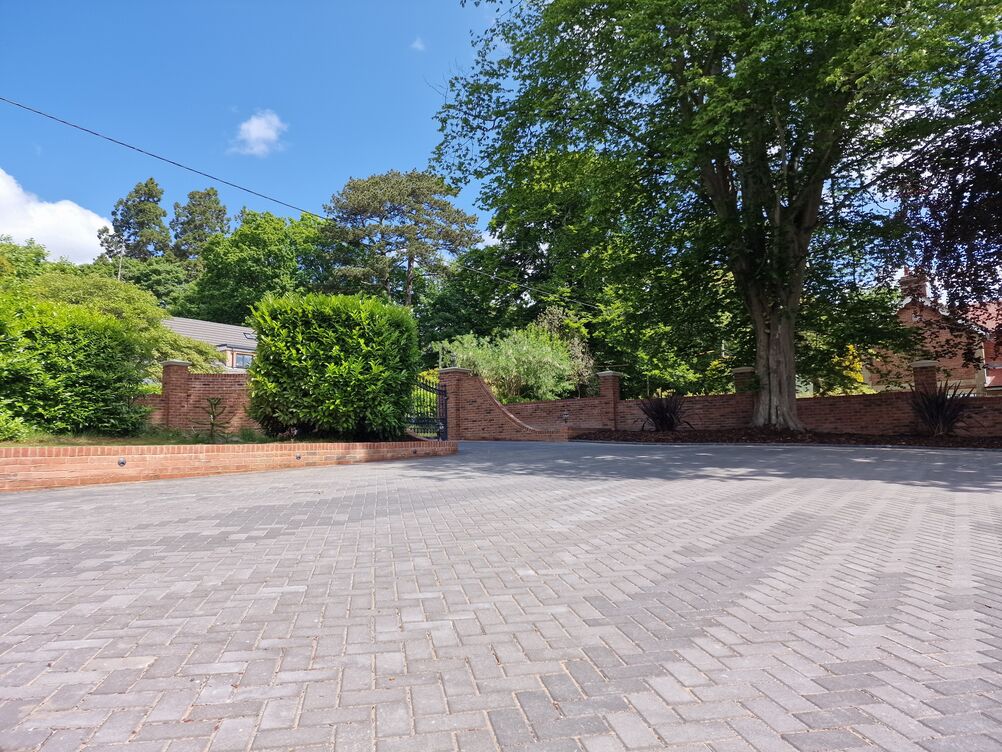150 metre Boundary Brickwork Wall and 285 sqm Block Paving. Special piling and steelwork design provisions taken to protect TPO tree roots.