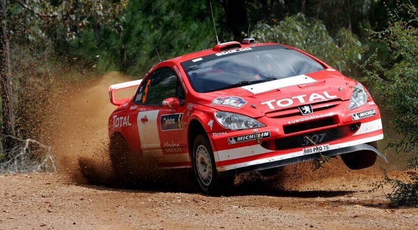 Custom motorsport wrap and graphics on a Peugeot 307 World Rally Car