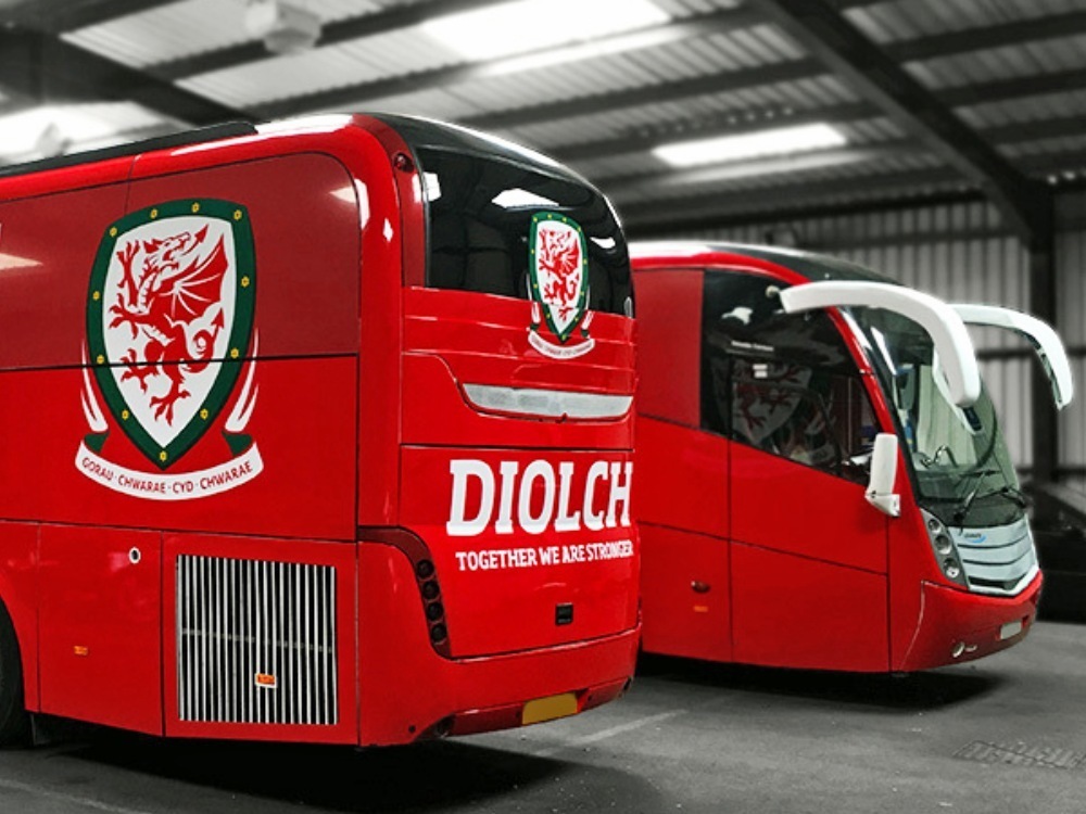 FA Wales badge vinyl graphics on red wrapped Caetano Levante coach.