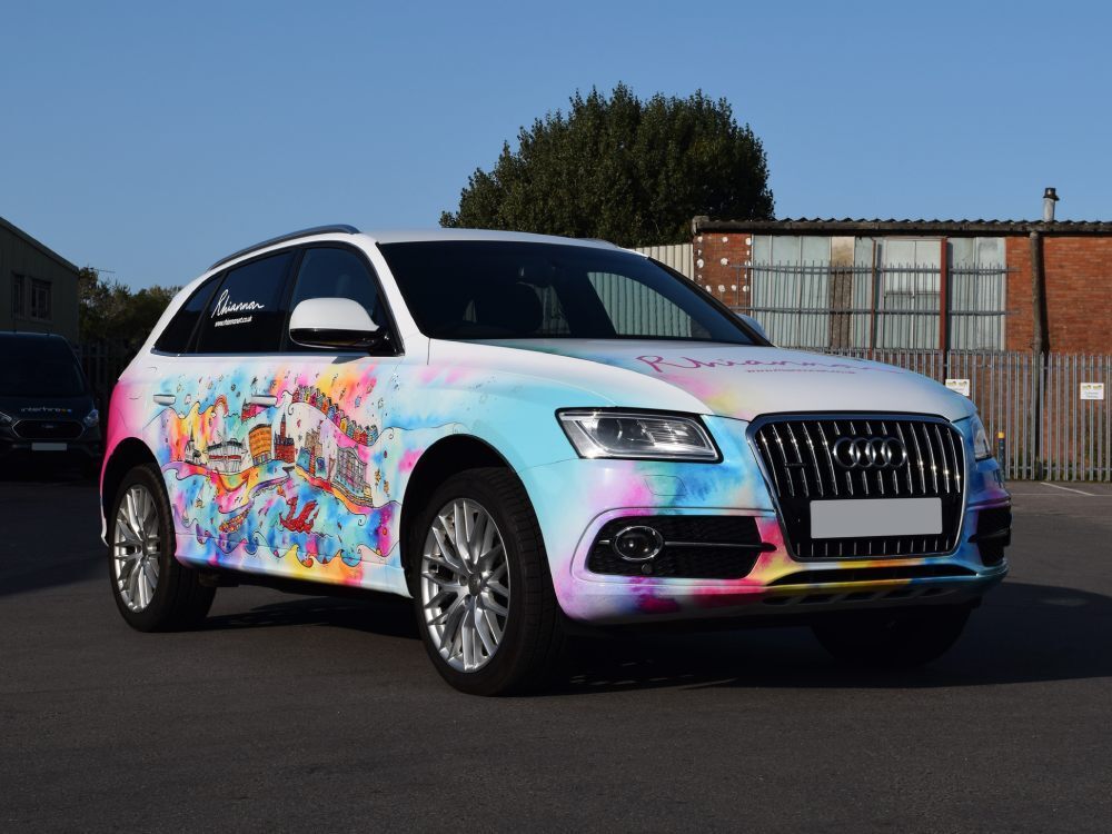 Company branded vehicle wrap on an Audi Q5.