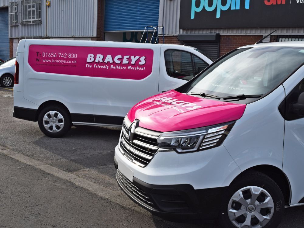 Pink branded vehicle vinyl graphics on company Renault Trafic van.