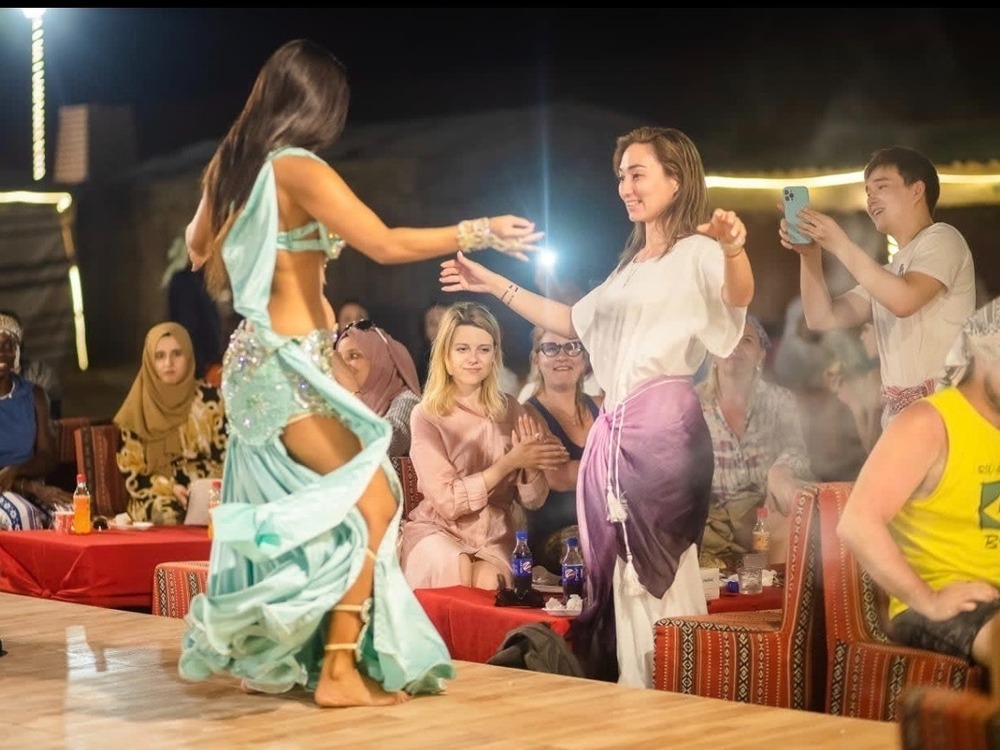 Evening red dunes, desert Safari with Dune bashing Camel ride sand boarding sunset photography barbecue dinner live authentic shows belly dancing fire show & Much More