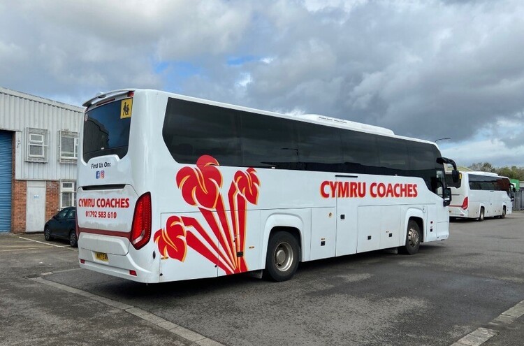 Calendered vinyl vehicle graphics on a coach
