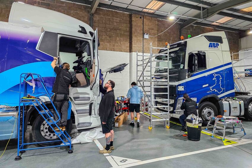 Vehicle wraps and graphics being installed onto a truck fleet at Popin in Cardiff.