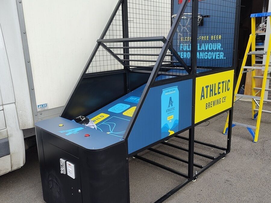 branded basketball arcade machine hire for Athletic Brewing Co side view
