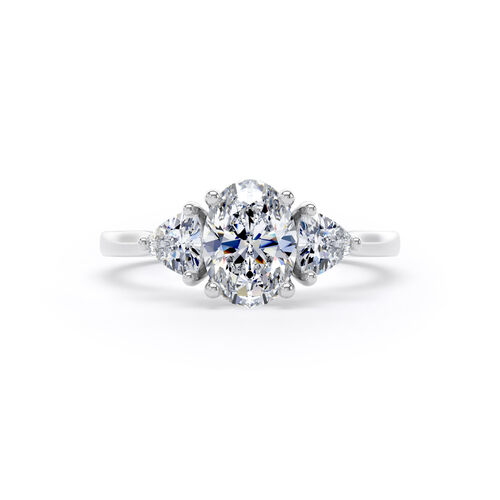 Oval and trilliant cut diamond trilogy ring
