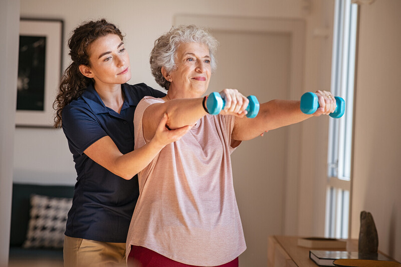Private home physiotherapist providing rehabilitation to an older adult in Essex