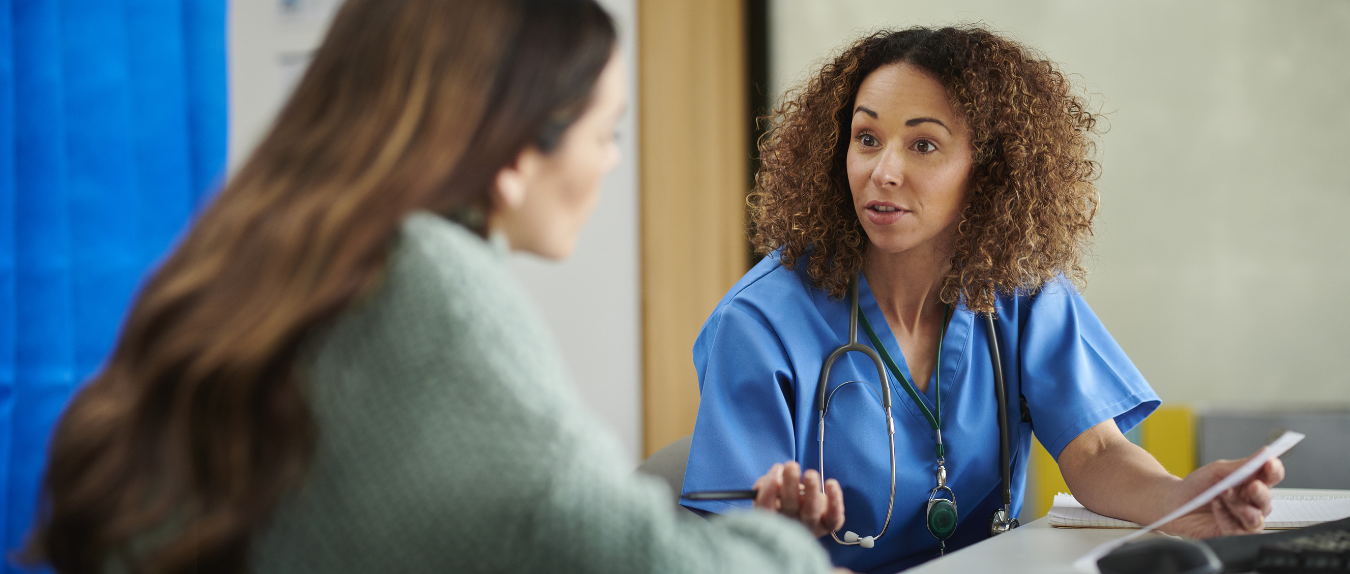 GP consulting with a patient about their medical history