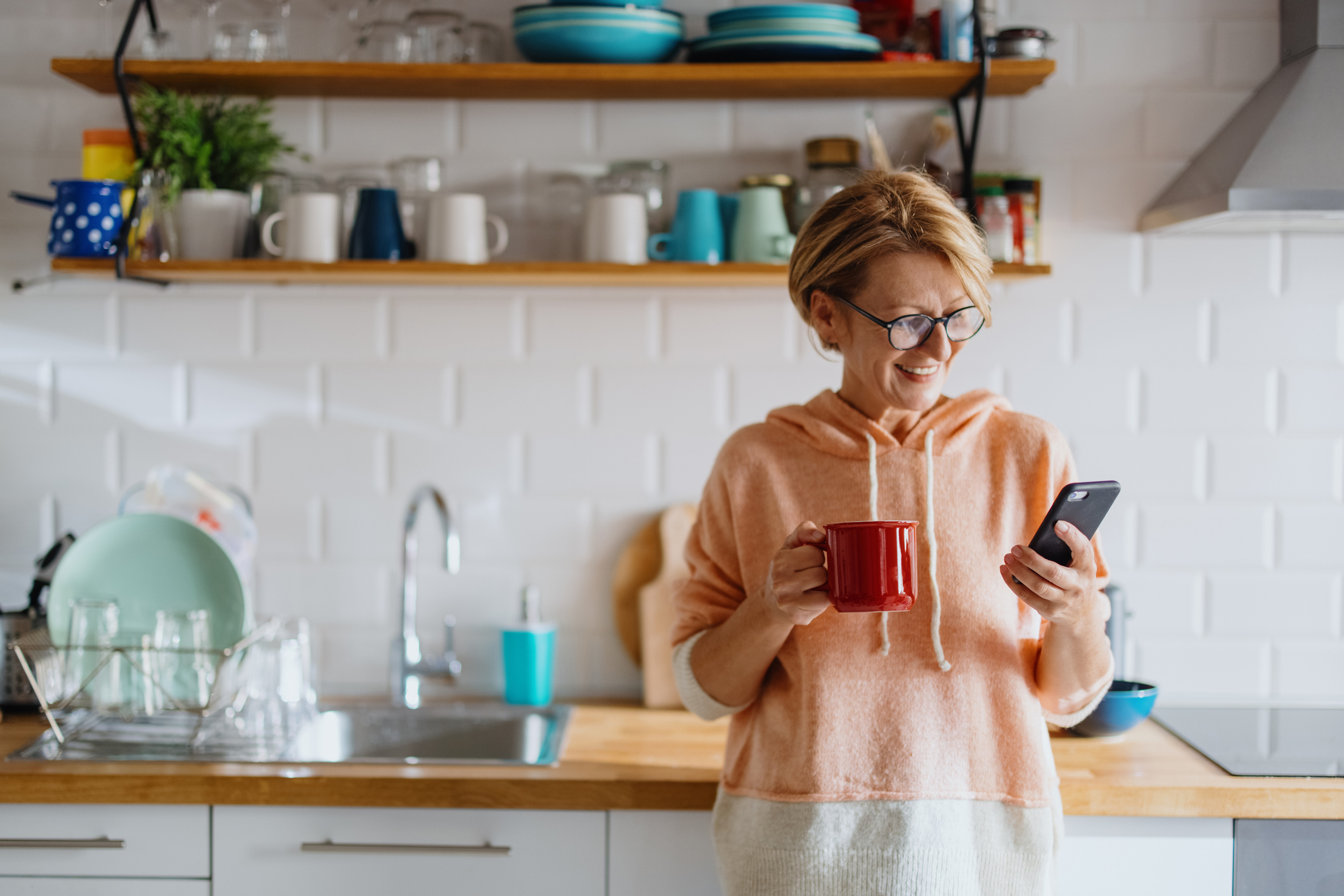 Woman comparing AXA health insurance pricing on her phone