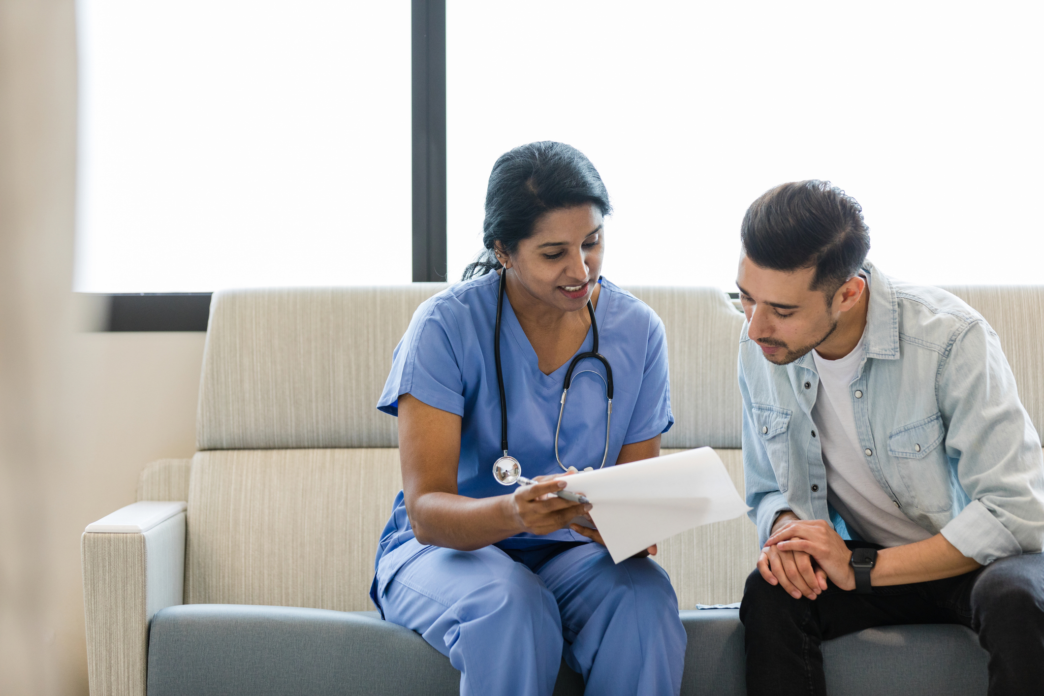 A private doctor discussing treatment options with a patient