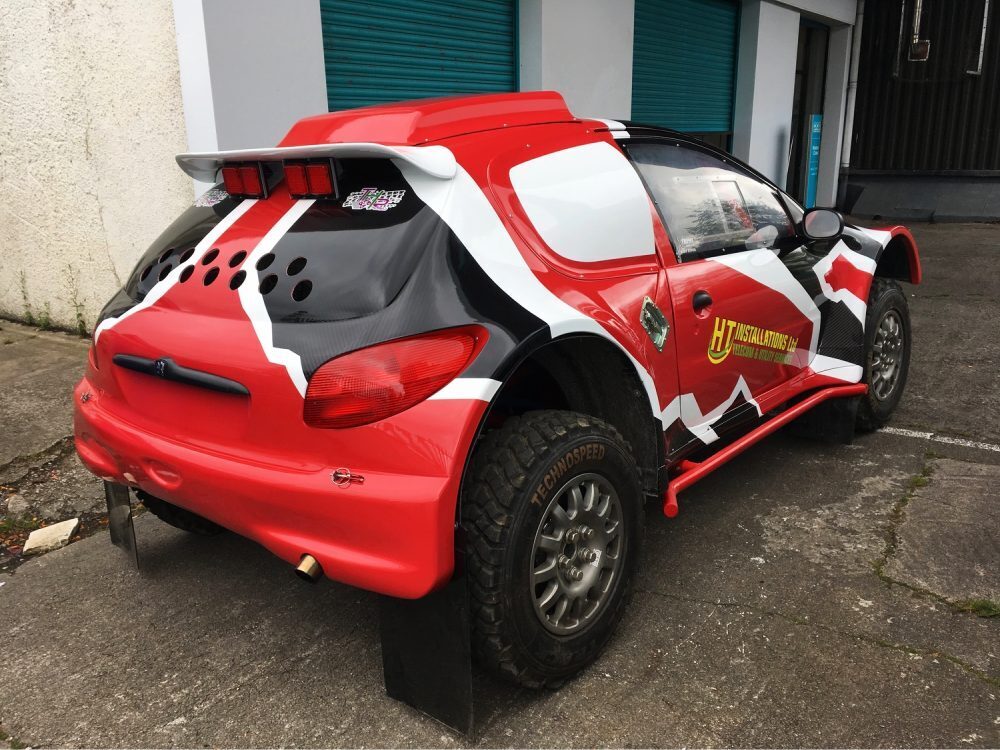 Motorsport wrap and vinyl graphics on Peugeot 206 rally car