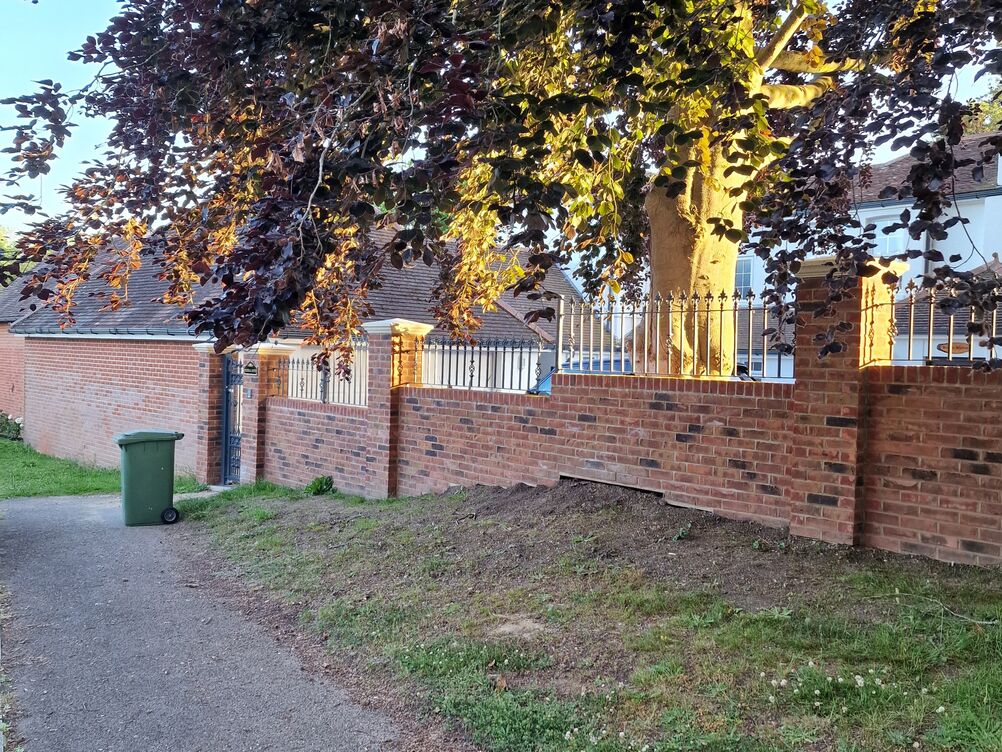 150 metre Boundary Brickwork Wall and 285 sqm Block Paving. Special piling and steelwork design provisions taken to protect TPO tree roots.