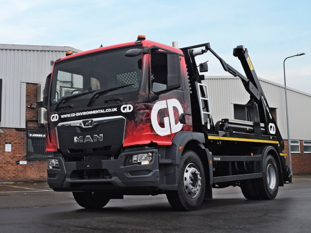 Vehicle vinyl wrap and graphics on a company MAN truck.