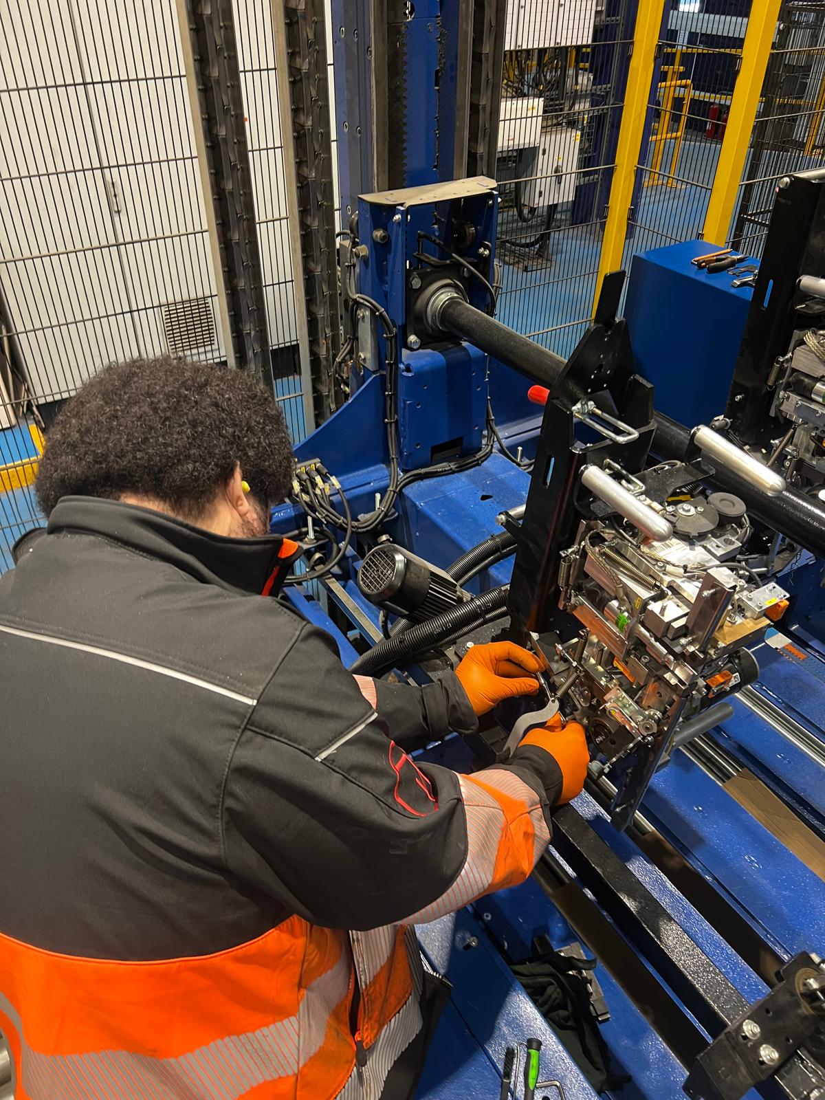 HPS engineer Callum servicing a strapping machine on site