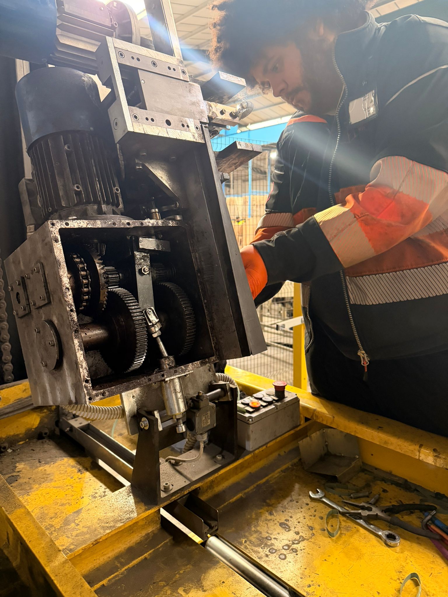 Engineer working on end-of-line packaging equipment