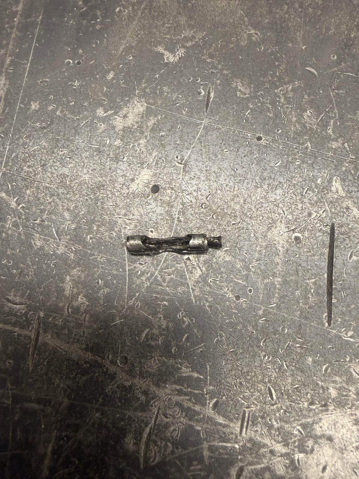 Collapsed roll pin on Mosca platen gripper assembly