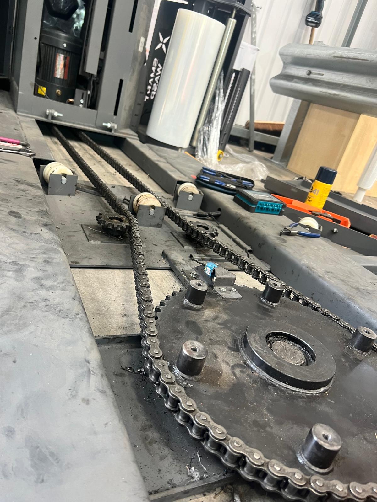 Pallet wrapper mechanism and wear points