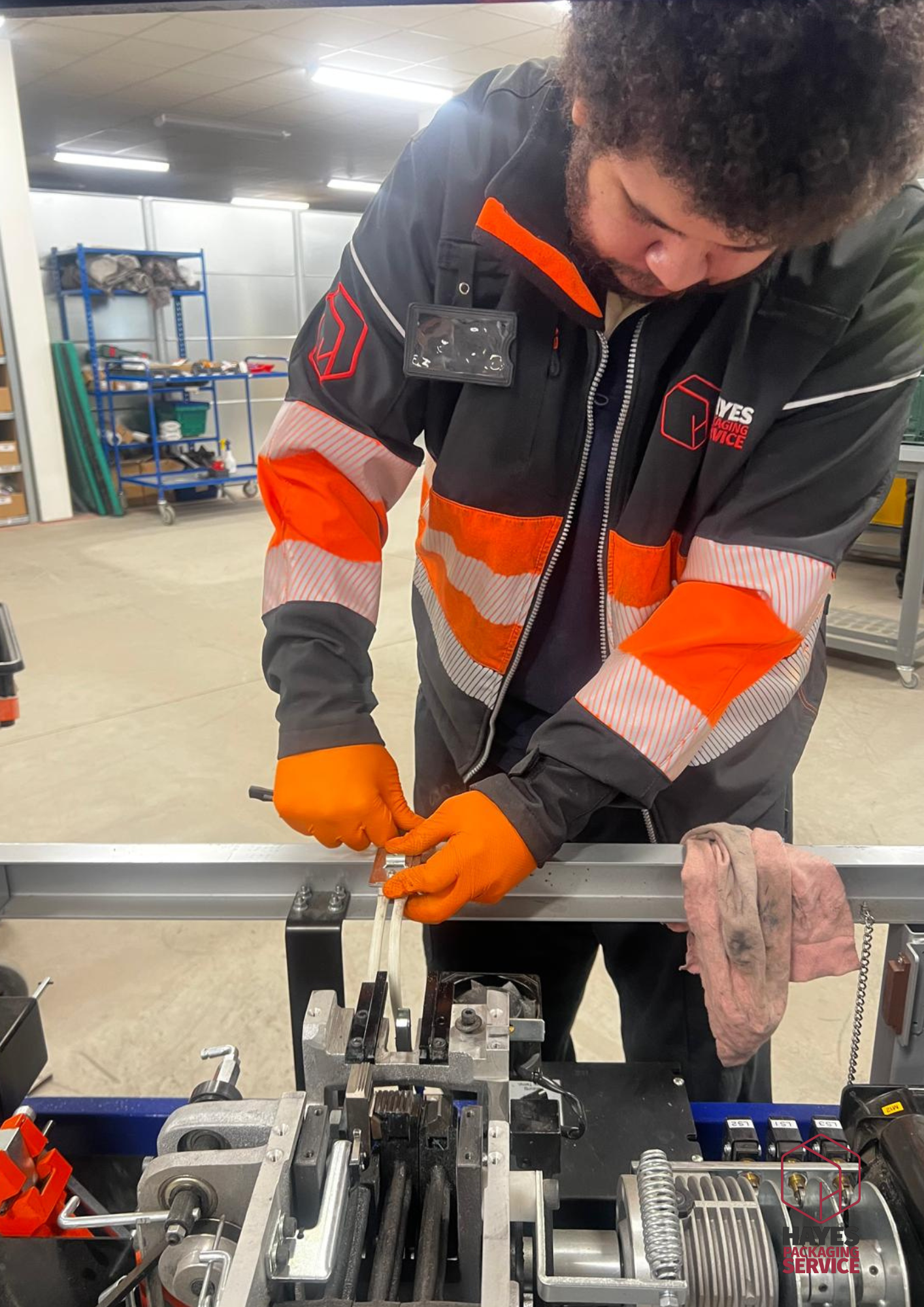 Engineer working across a packaging line