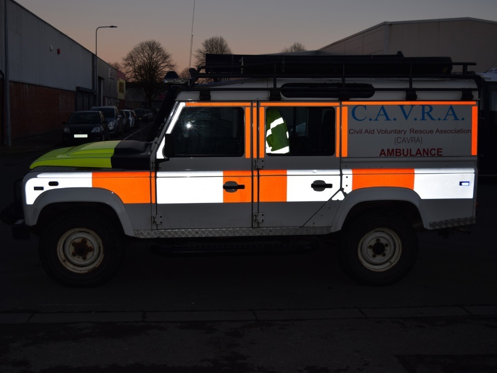 Reflective safety vinyl graphics on an ambulance.