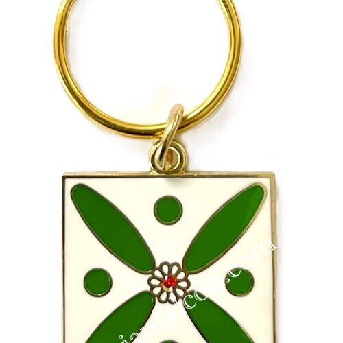 Charm. The Persian Cross. White on Green with 1 Central Red Stone.