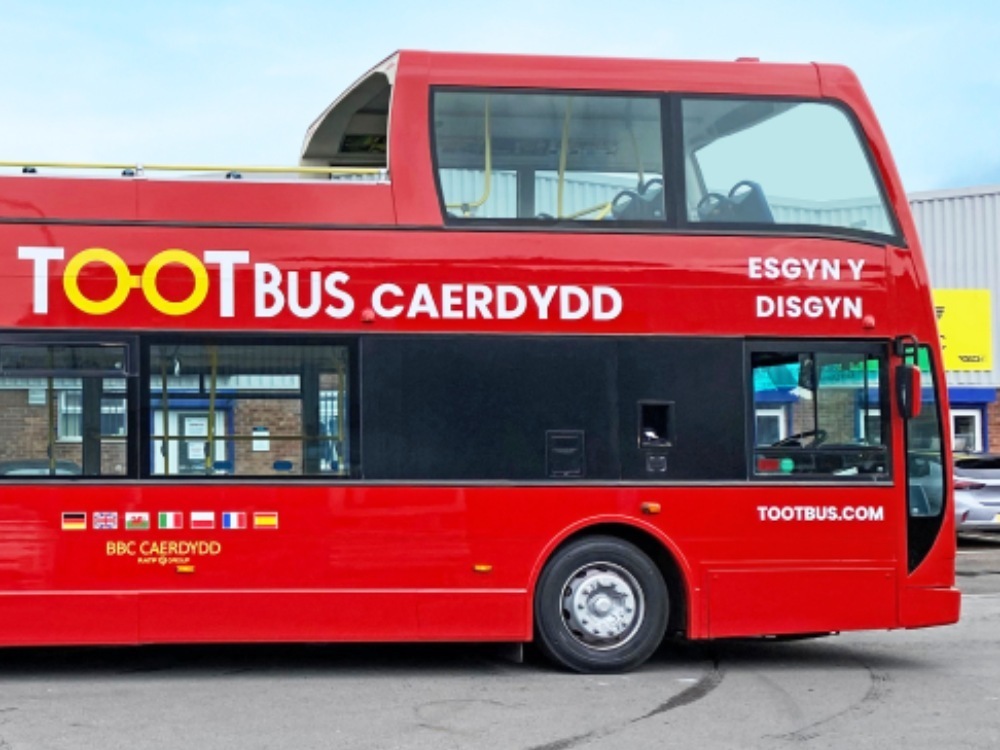 Front end of Tootbus company branded red Ayats Bravo city open top bus.