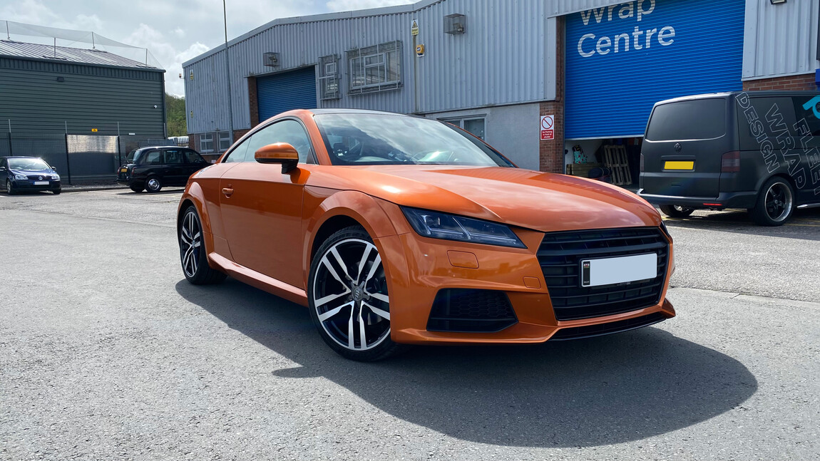 An Audi with a new orange vehicle colour change wrap