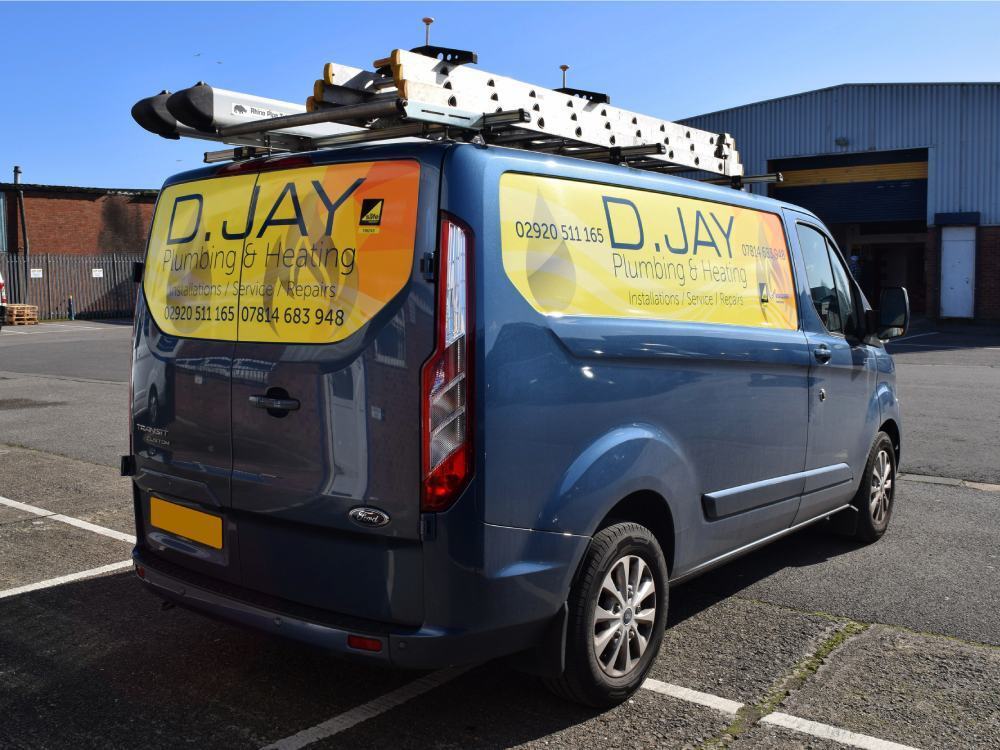 Yellow branded infill panel graphics on blue company Ford Transit Custom van.