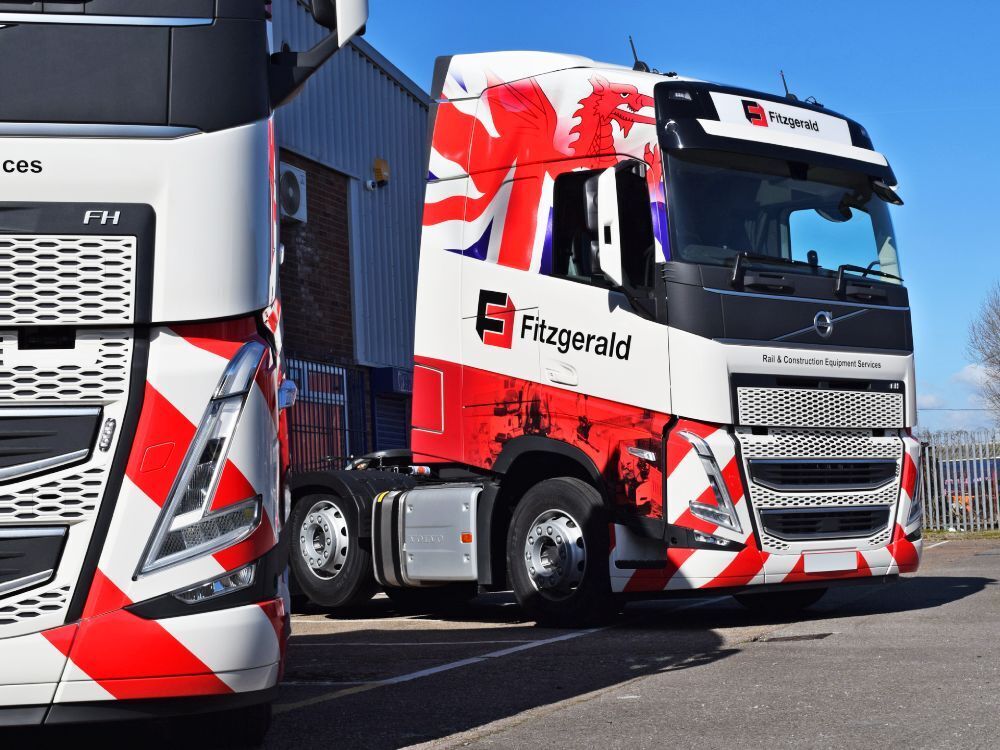 Newly installed vehicle wraps and graphics on Volvo lorry cabs.