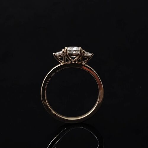 Cushion and trilliant cut trilogy ring