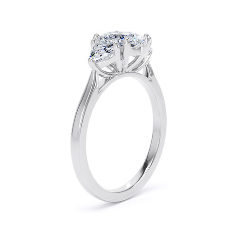 Oval and trilliant cut diamond trilogy ring