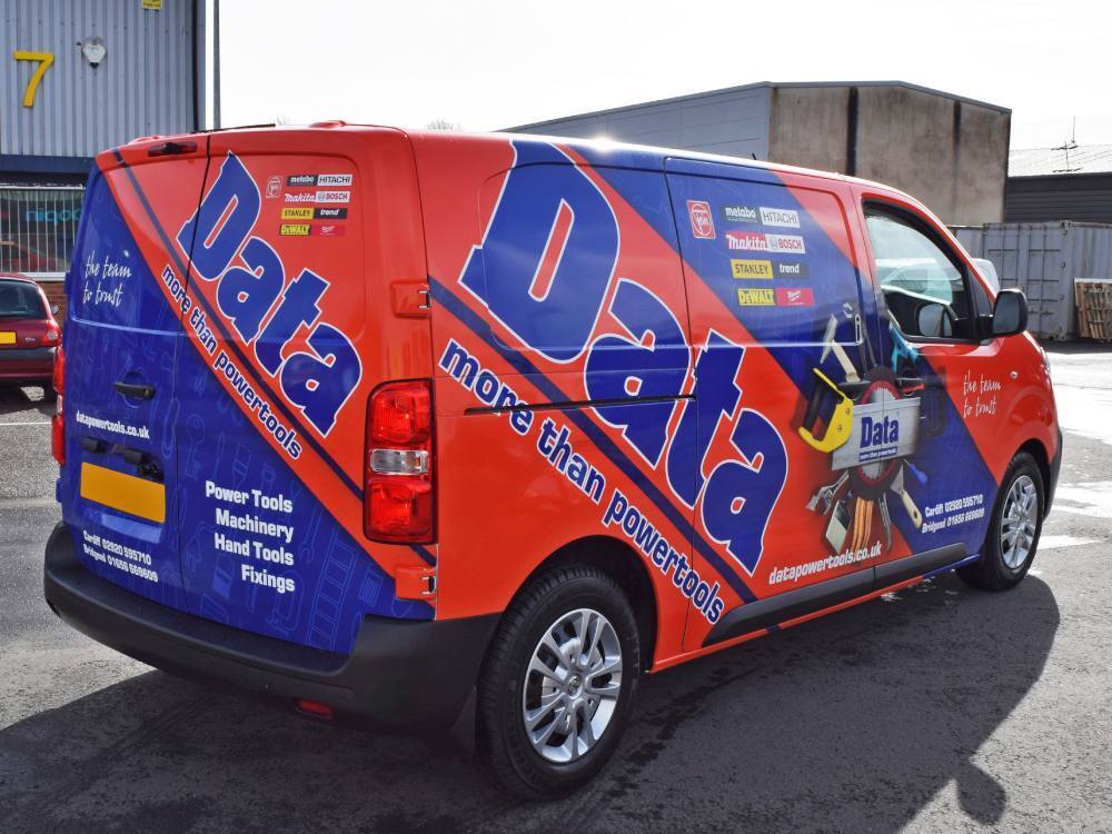 Vauxhall Vivaro with blue and orange company branded van wrap.