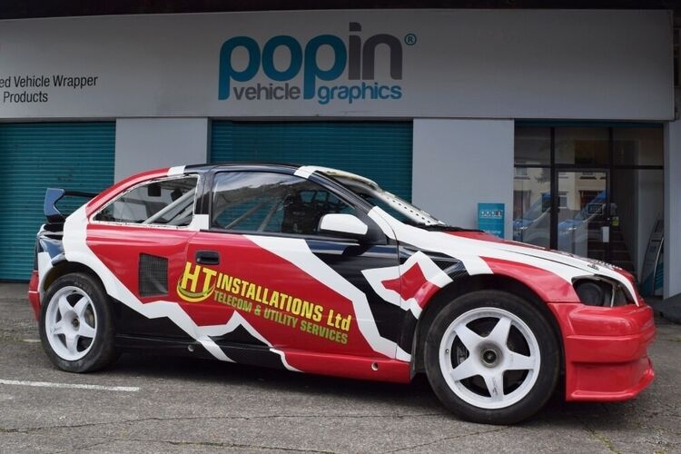 Vauxhall Astra with motorsport wrap and graphics outside Popin in Cardiff.