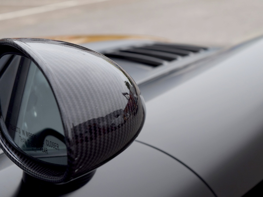 Close up of chequered wing mirror wrap on Dodge Viper SRT10 sports car