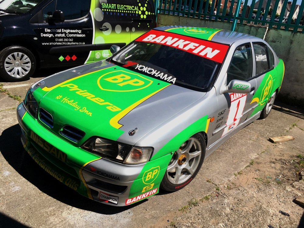 Motorsport wrap and decals on a Nissan Primera race car
