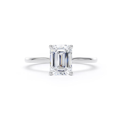 Emerald cut solitaire with diamond set shoulders