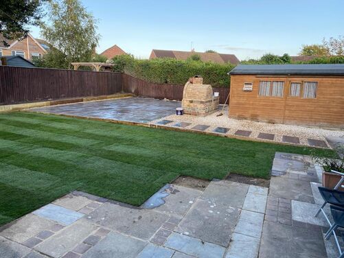 A large patio area created for use around a bbq. Including a new lawn