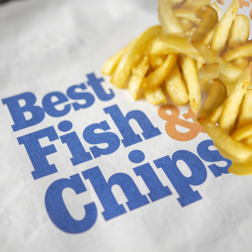 A portion of chips on printed paper with the text Best Fish &amp; Chips