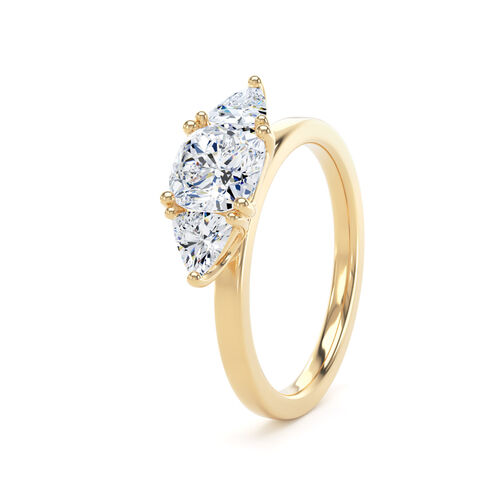 Cushion and trilliant cut diamond trilogy ring
