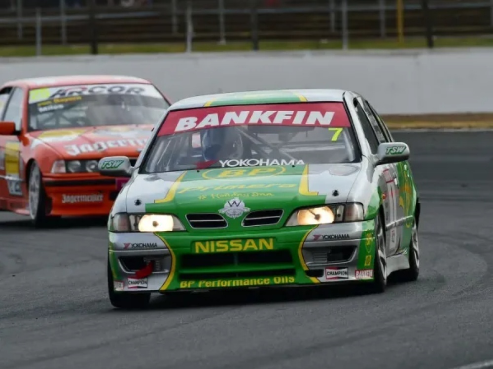 Nissan Primera race car with green and silver motorsport livery