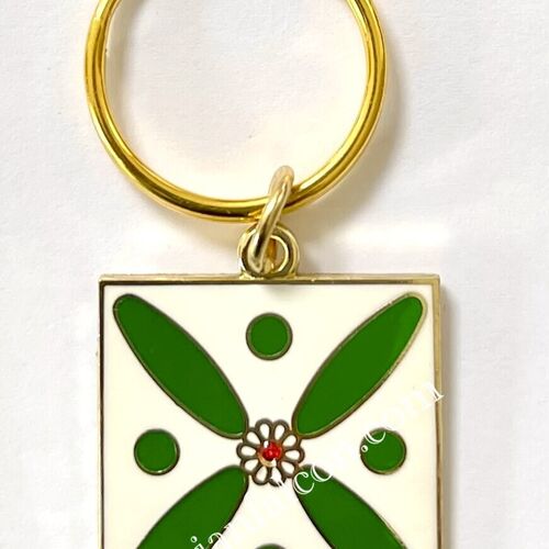 Charm. The Persian Cross. White on Green with 1 Central Red Stone.