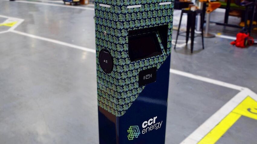 Business branded templated graphic installed on an Inspire Green EV charger.