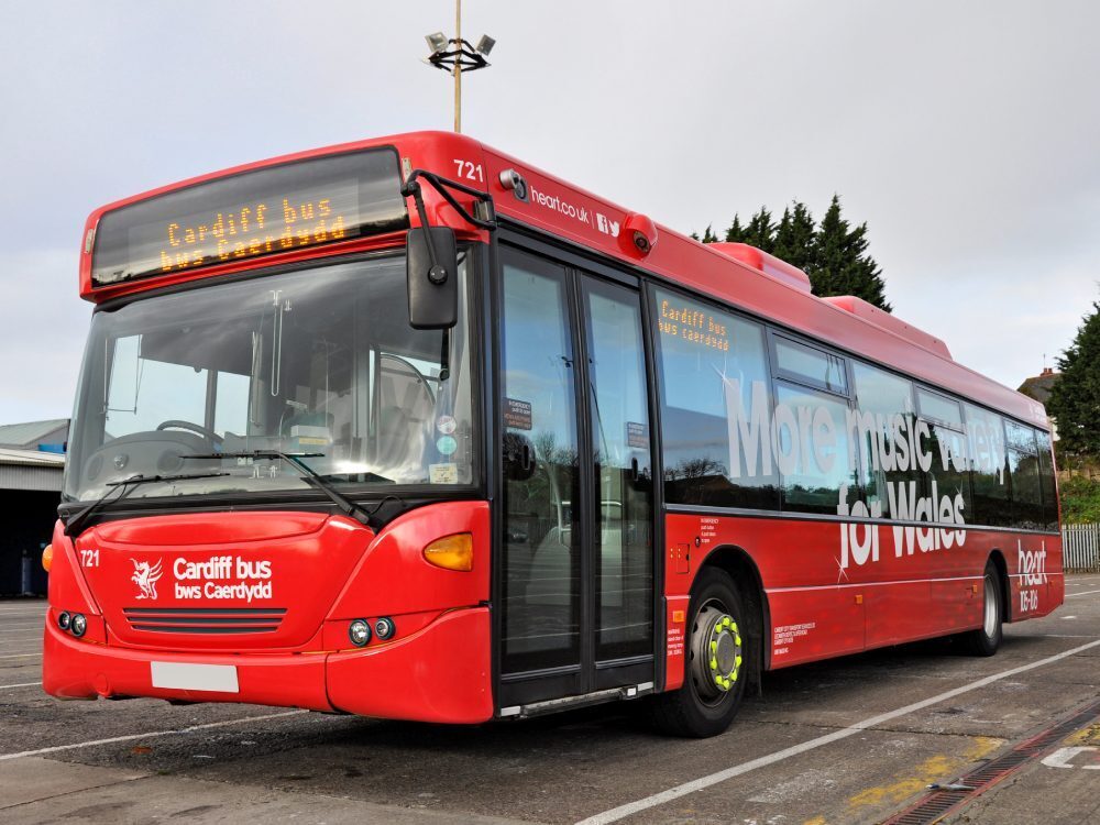 Red vehicle wrap and Heart FM branded graphics on Cardiff Bus Scania Omnilink.
