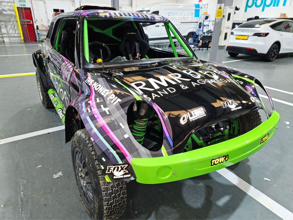 Bright colourful vinyl graphics and decals on Mini Cooper V6 rally car