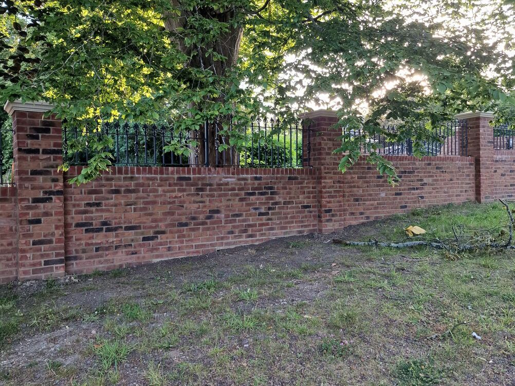 150 metre Boundary Brickwork Wall and 285 sqm Block Paving. Special piling and steelwork design provisions taken to protect TPO tree roots.