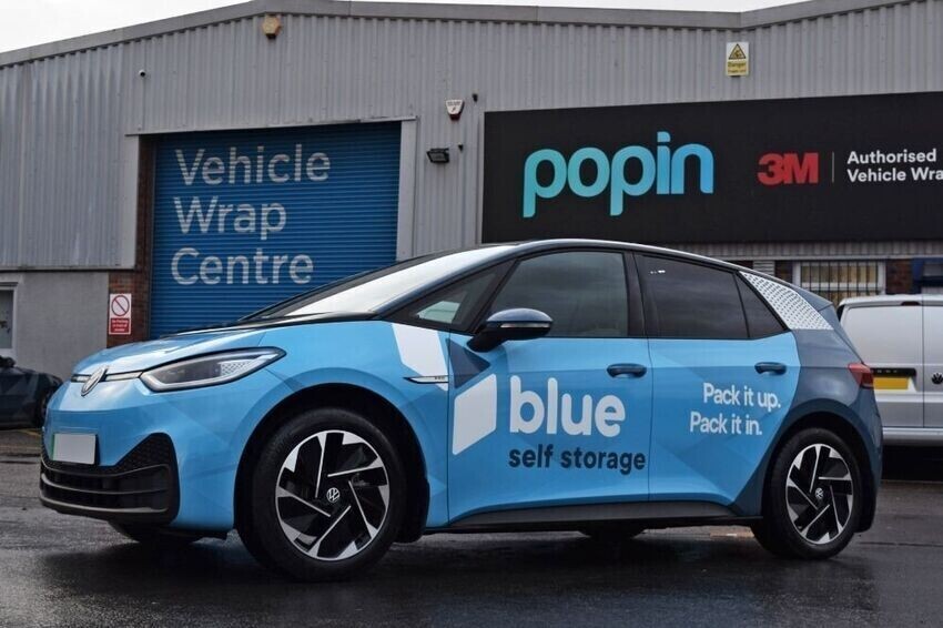 Company car with branded eco-friendly pvc-free sustainable vehicle vinyl wrap and graphics.